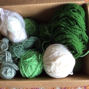 A Bunch of green and white yarn Lot weights 2 lbs. 12 oz  Yarn liquidation week